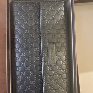 All black MicroGucci wallet used ONCE
